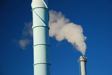 White Smoke Against Blue Sky. Urban Pollution Stock Photo White Smoke Against Blue Sky. Urban Pollution Stock Photo