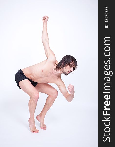 Young attractive man dancing contemporary in studio. Young attractive man dancing contemporary in studio