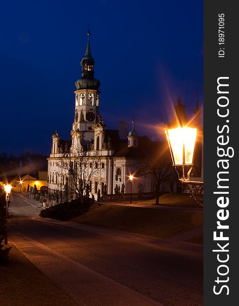 Illuminated Loreta church at night in Prague at Czech Republic