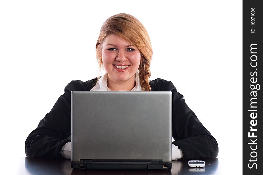 The businesswoman works at the computer at office