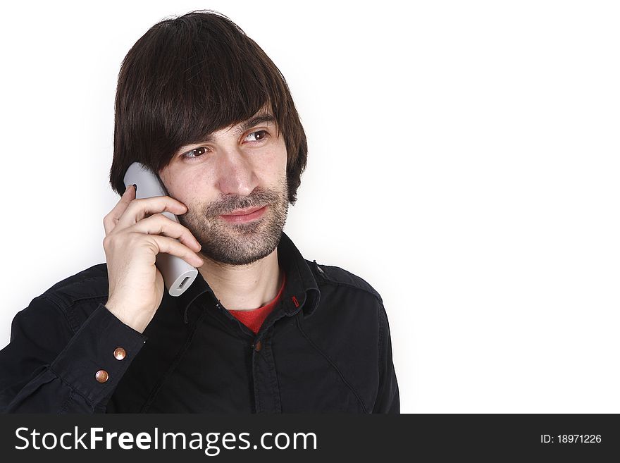 Young man concerned with telephone. Young man concerned with telephone