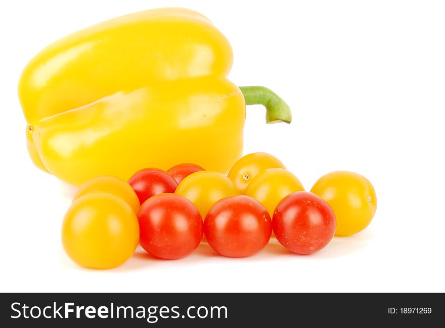 Juicy cherry tomatoes and   sweet pepper isolated on the white.