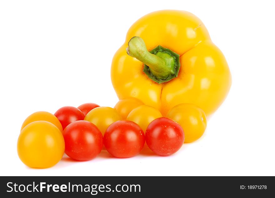 Juicy cherry tomatoes and sweet pepper isolated on the white. Juicy cherry tomatoes and sweet pepper isolated on the white.