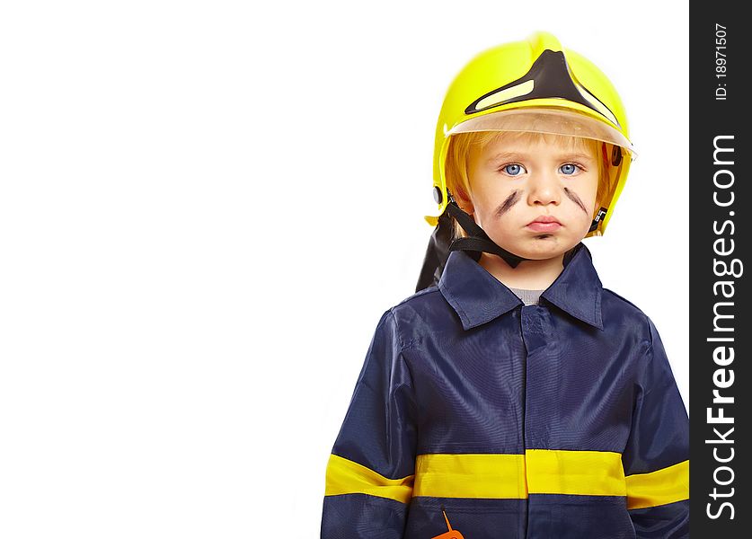 Serious little boy in fireman costume isolated on white background. Serious little boy in fireman costume isolated on white background