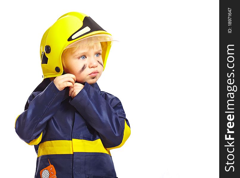 Little boy in fireman costume dress of his helmet on white background. Little boy in fireman costume dress of his helmet on white background