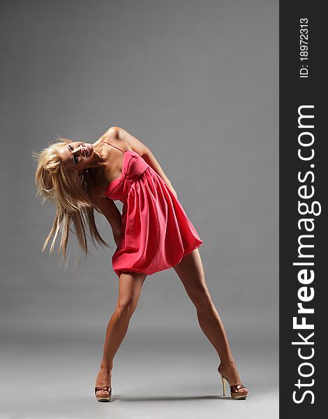 Modern style dancer posing on studio background. Modern style dancer posing on studio background