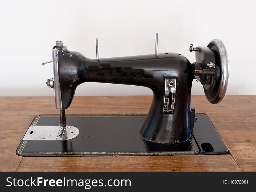 Old sewing machine in the foreground