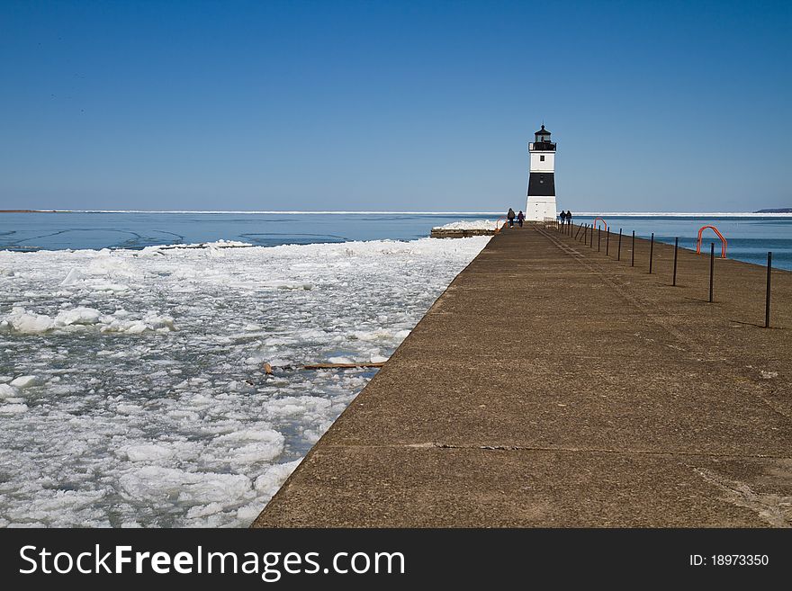 Lighthouse on Lake Erie at the end of a cement dock