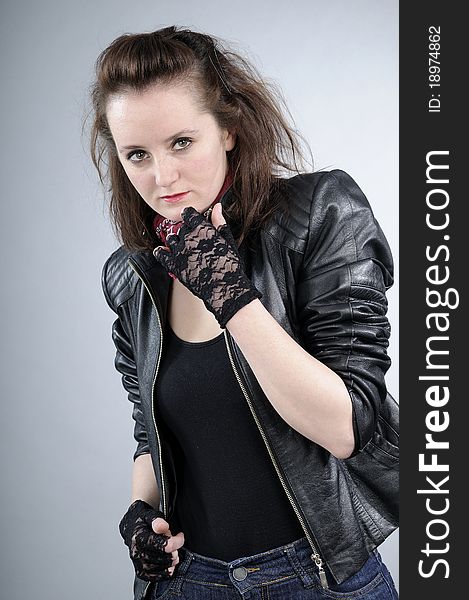 Young white girl posing with black jacket and accessories. Young white girl posing with black jacket and accessories