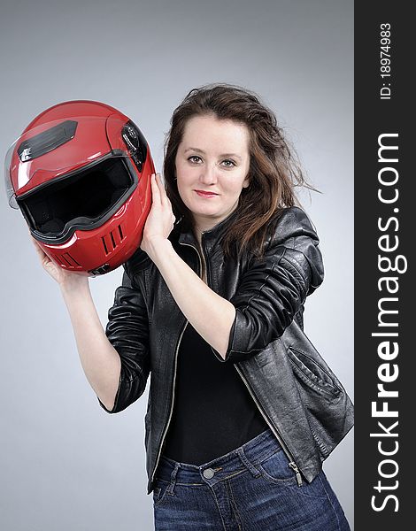 Young white girl posing with black jacket and red accessory. Young white girl posing with black jacket and red accessory