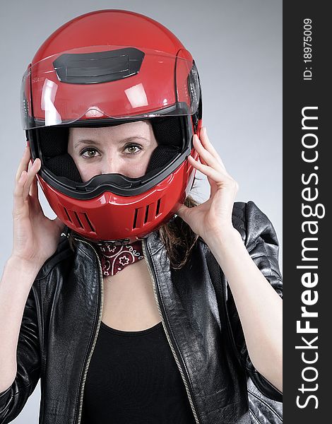 White girl posing with black jacket and red accessory. White girl posing with black jacket and red accessory