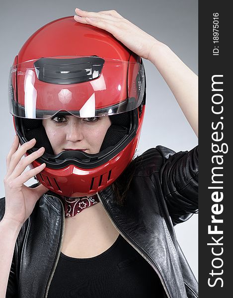 White girl posing with black jacket and red accessory. White girl posing with black jacket and red accessory