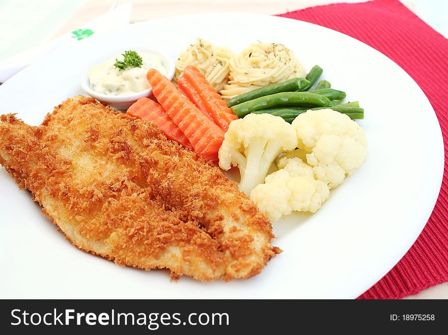 Fish steak served on a table with cream. Fish steak served on a table with cream