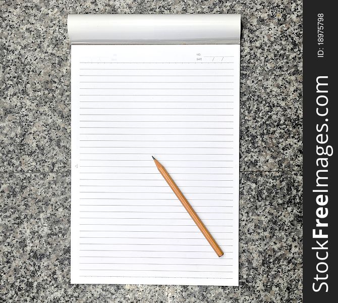 Image of Blank open notebook and pencil