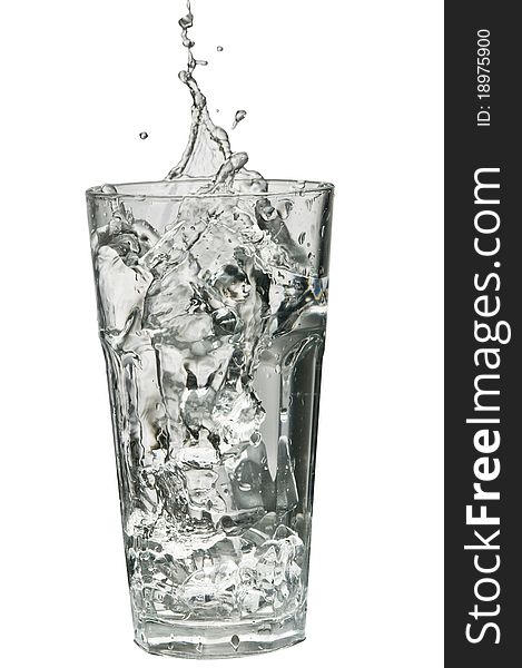 Water splashing out of a glass isolated over white background with clipping path