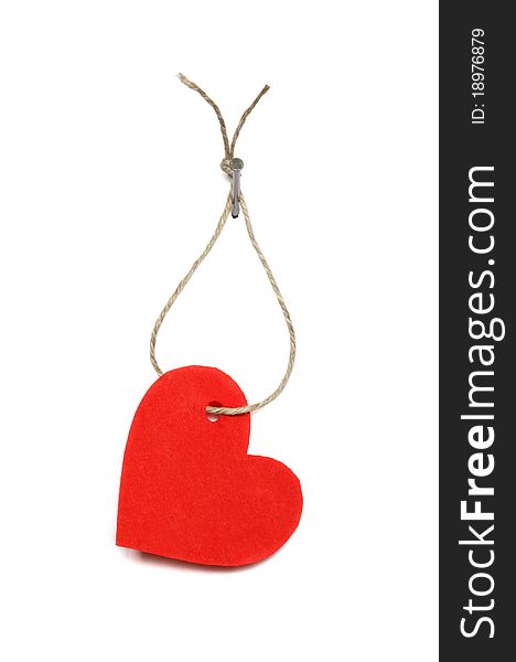 Red paper heart hanging on white background with rope and nail. Red paper heart hanging on white background with rope and nail