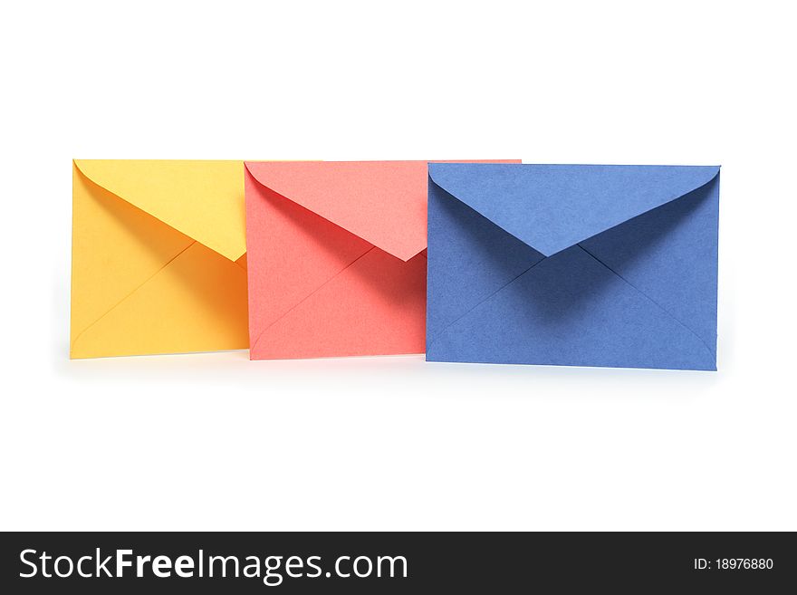 Colorful empty envelopes standing in a row on white background. Clipping path is included