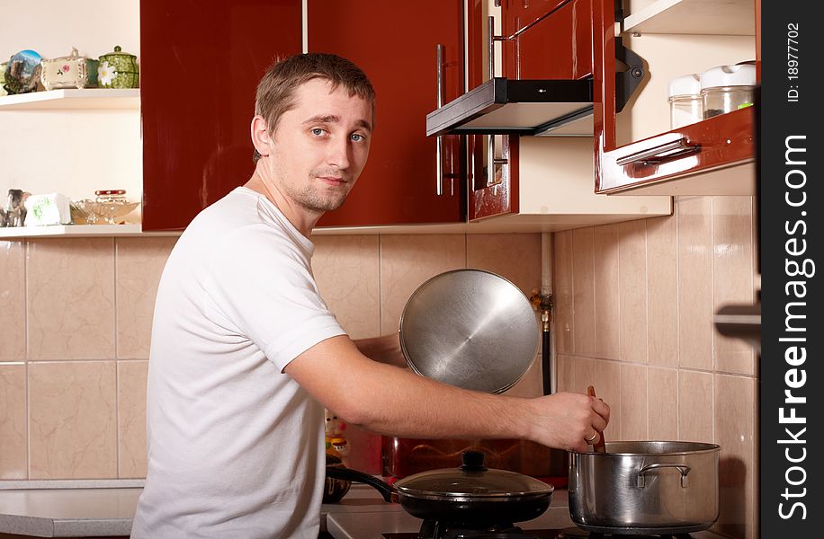 Photo of young man cooking