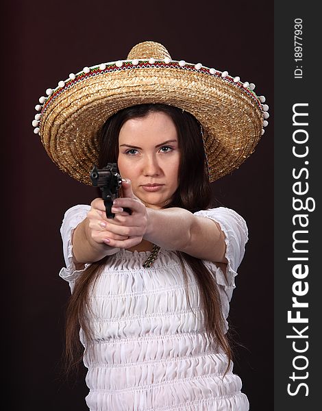 Mexican girl hold revolver