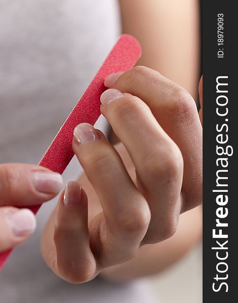 Woman polishing her nails, close-up. Woman polishing her nails, close-up