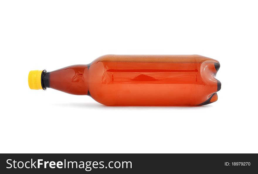 Plastic bottle of beer on white background