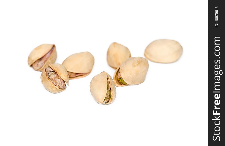 Salted pistachios on a white background