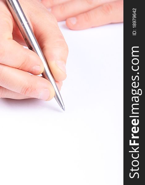 Hand with a pen writing on white paper. ideal for copy space. Hand with a pen writing on white paper. ideal for copy space