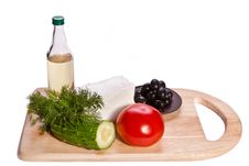 Vegetables, Cheese And Oil On The Cutting Board Royalty Free Stock Photography Vegetables, Cheese And Oil On The Cutting Board Royalty Free Stock Photography