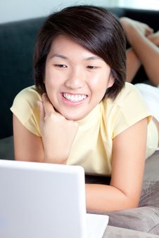 Young Asian Girl Browsing The Net On Couch Stock Image Young Asian Girl Browsing The Net On Couch Stock Image