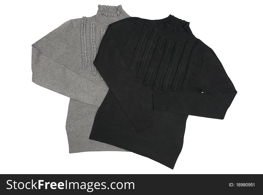 Black and gray sweaters isolated on a white background. Black and gray sweaters isolated on a white background.