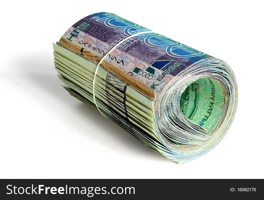 Roll of kazakh money held by Rubber band isolated on white. Roll of kazakh money held by Rubber band isolated on white