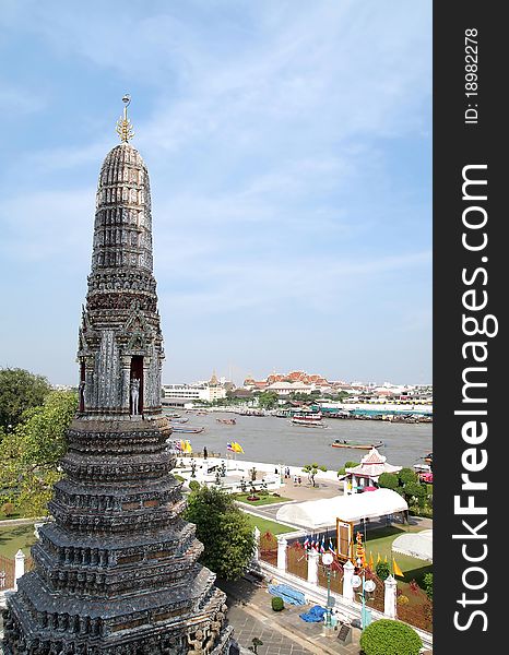 View from Top of Pagoda in the Wat Arun (Temple of the Dawn) is a Buddhist temple (wat) in the Bangkok Yai district of Bangkok, Thailand with blue sky and River background . View from Top of Pagoda in the Wat Arun (Temple of the Dawn) is a Buddhist temple (wat) in the Bangkok Yai district of Bangkok, Thailand with blue sky and River background .