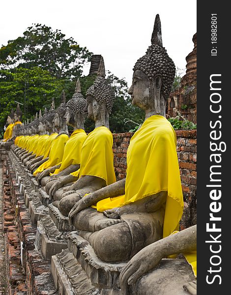 Row of Sacred Buddha images in Ayutthaya, Thailand