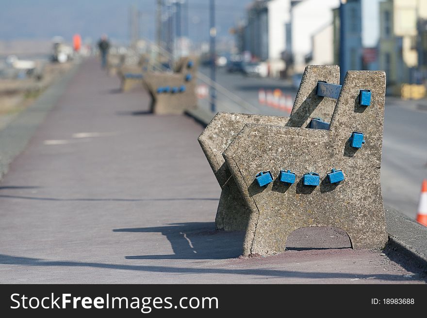 A Concrete Seat Situated On A Deserted Promenade