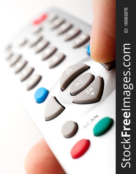 Remote control in a hand - macro image