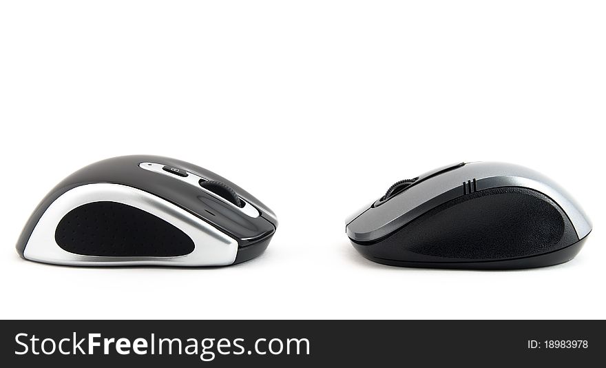 Two computer mouse of dark blue color on a white background