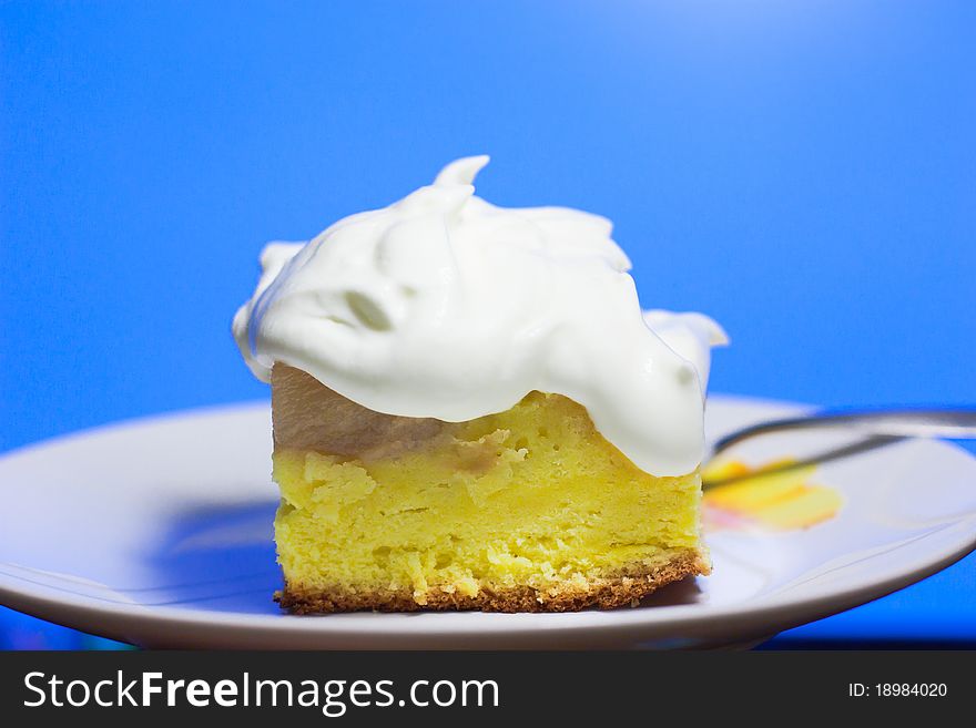 Closeup of a piece of cake on blue background. Closeup of a piece of cake on blue background