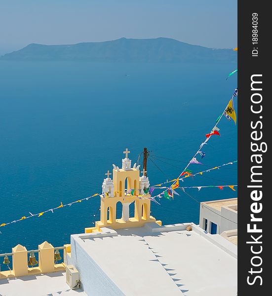 Amazing view of yellow chapel in Oia, Santorini