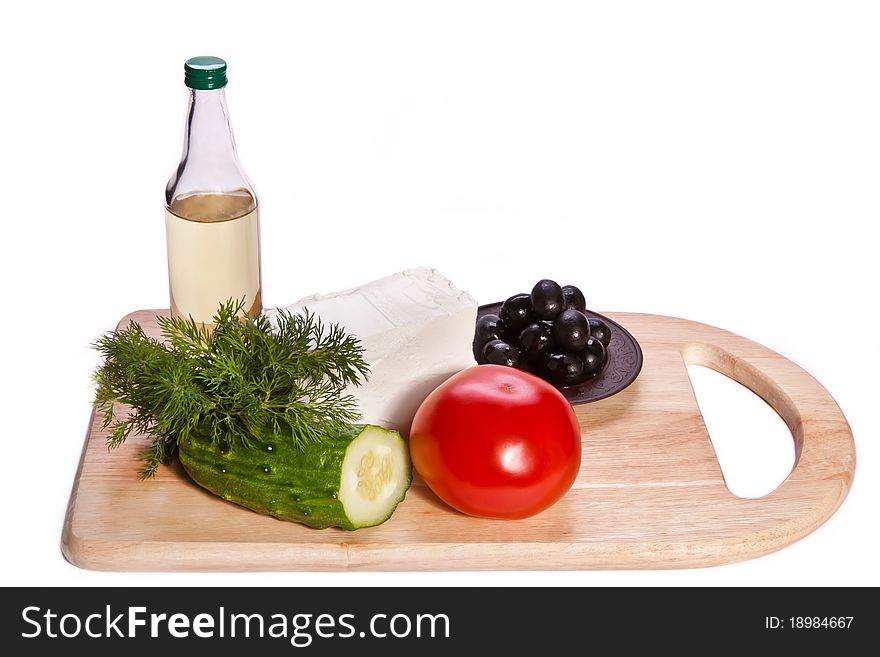 Vegetables, Cheese And Oil On The Cutting Board