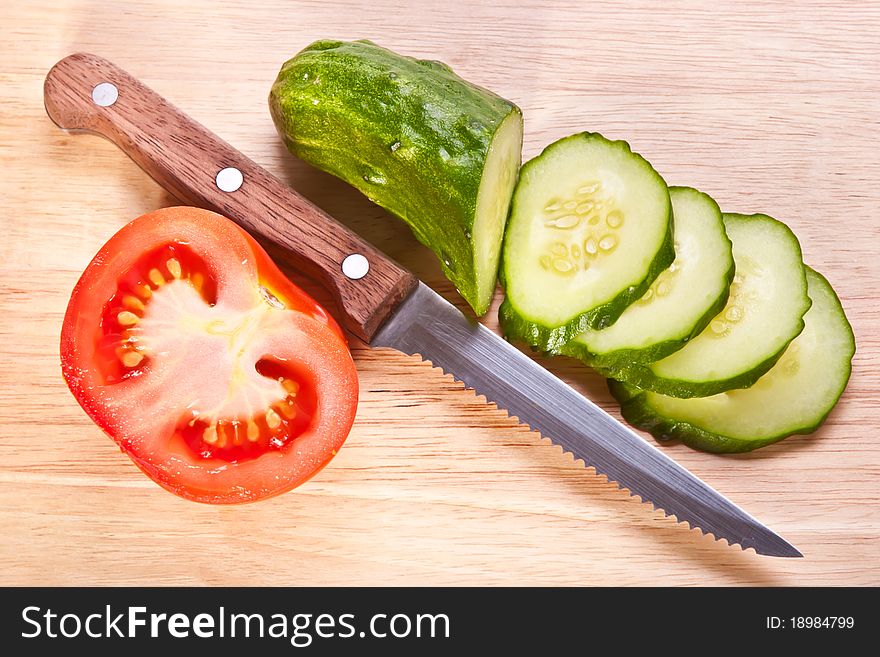 Fresh cut vegetables on the wooden table. Fresh cut vegetables on the wooden table