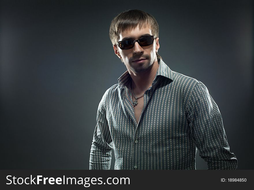 Portrait of handsome young and pretty man in sundglasses. Portrait of handsome young and pretty man in sundglasses