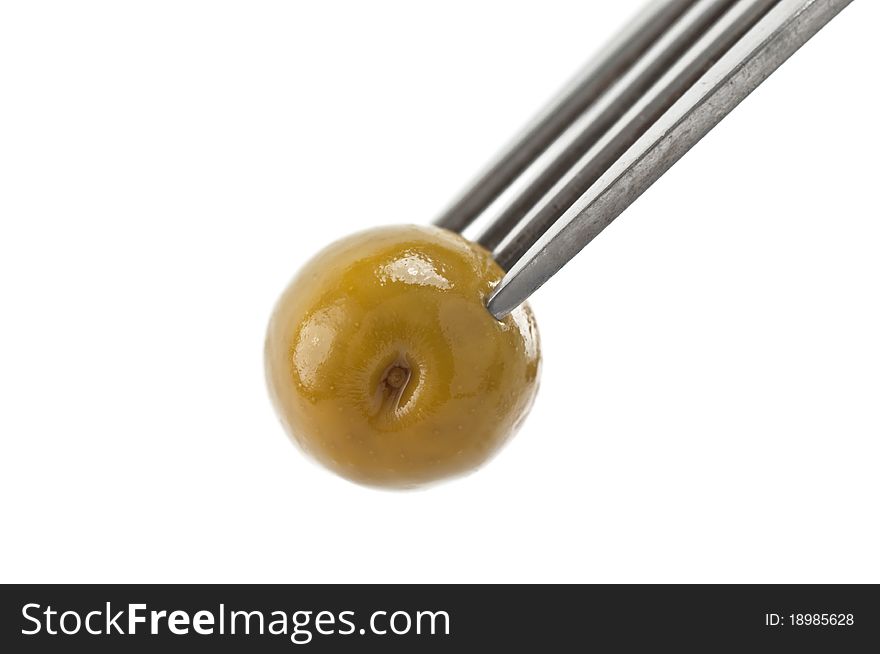 Olive on fork isolated on white background