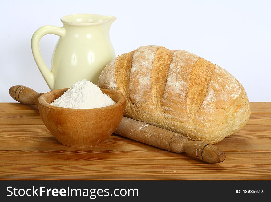 Fresh bread on the table on a white background