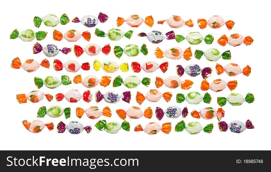 Assorted colorful candies in plastic wraps isolated in white background