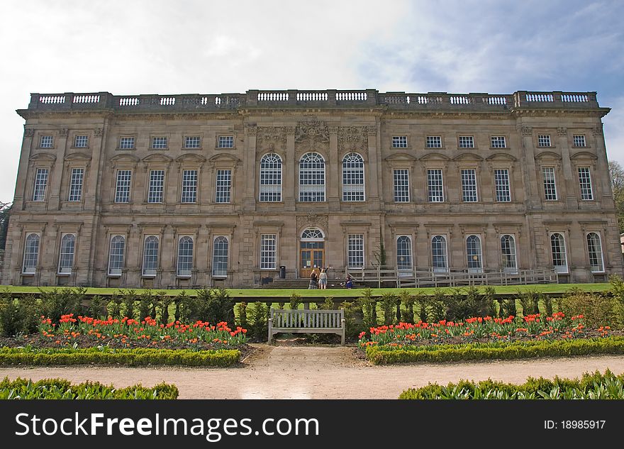 Frontage of an Eighteenth Century Stately home and lawns under a blue sky