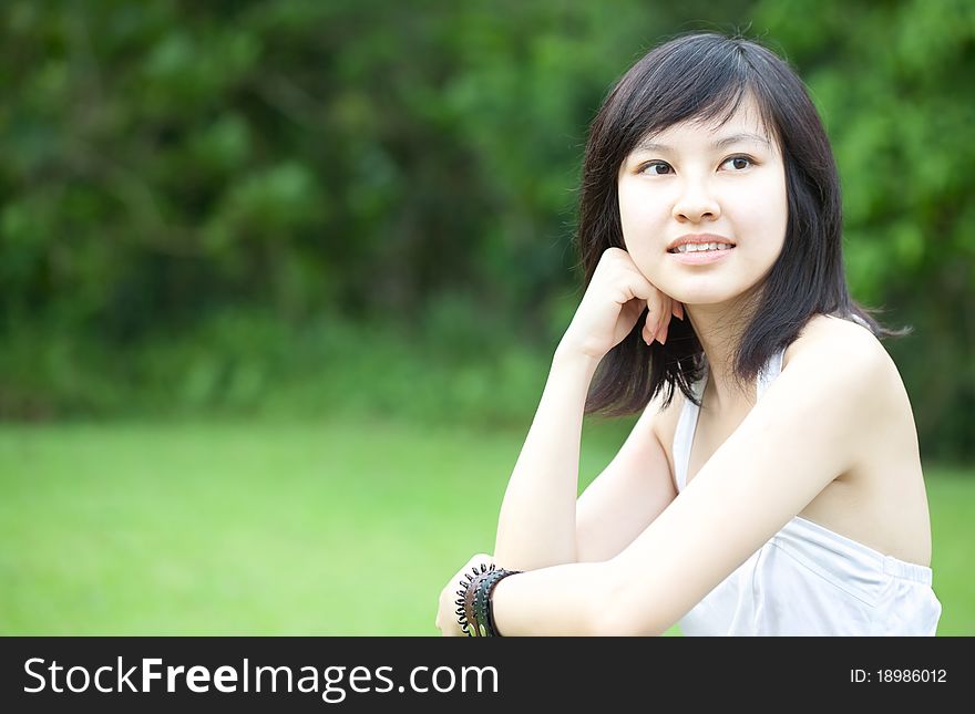 Beautiful Asian Chinese/Japanese girl in white dress enjoying outdoors. Beautiful Asian Chinese/Japanese girl in white dress enjoying outdoors