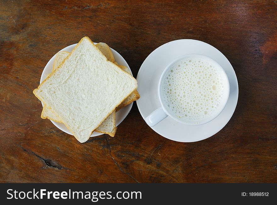 Bread and hot milk on the table