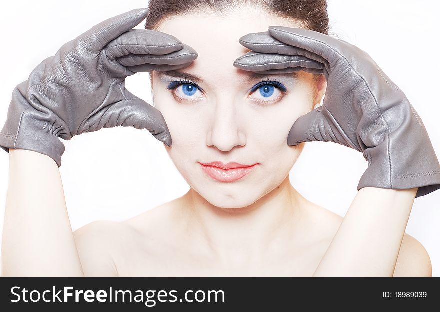 Beautiful young woman face . Over white background