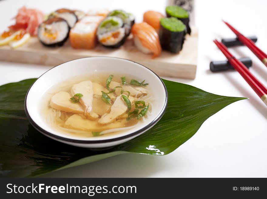 A set of japanese of rolls sushi and salmon soup. A set of japanese of rolls sushi and salmon soup