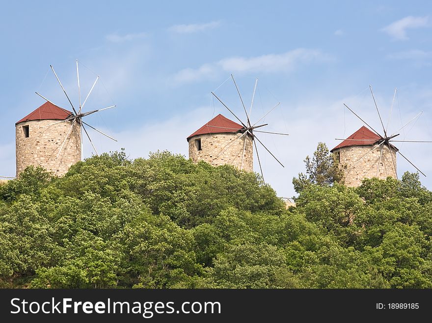 Traditional windmills on top of hill.